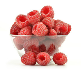 A dish with fresh raspberries isolated on white