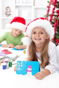 Kids making christmas greeting cards