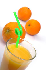 glass of fresh orange juice and fruits