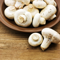 Fresh mushrooms on a wooden board