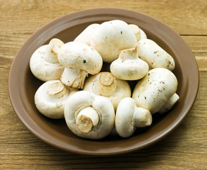 Fresh mushrooms on a wooden board