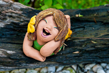be funny doll stone in garden