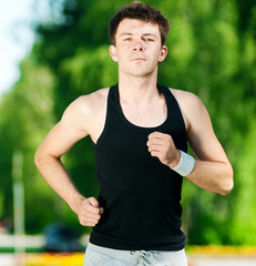 Young man jogging in park