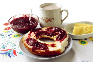 white flour croissant with butter and jam