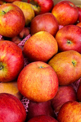 Fototapeta na wymiar Yummy pile of apples in a market stall.