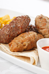 tasty cutlets with sauce and tortilla