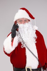 Santa talking on phone looking at camera