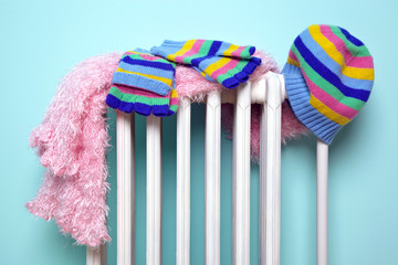 Girls hat scarf and gloves drying on a radiator