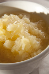 Crushed pineapple in a bowl as used in cooking