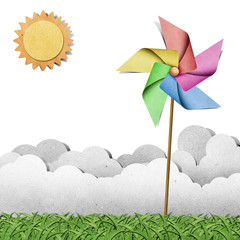 windmill on grass recycled papercraft  background