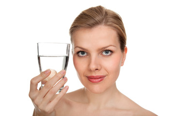 woman holding a glass of fresh water