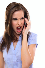 angry brunette woman making a call