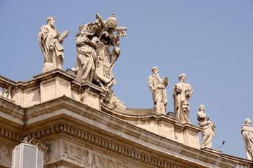 Fototapeta na wymiar Statues on top of a St. Peter's Basilica, Rome, Italy