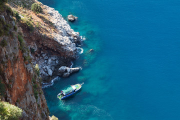 Diving ship at blue sea mountain beach bay