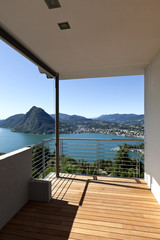 Fototapeta na wymiar Modern apartment, balcony, lake panoramic view