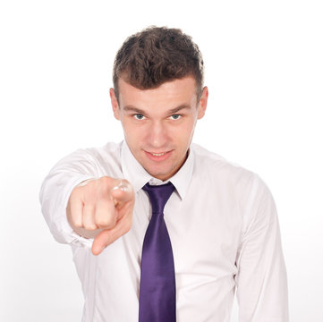 Portrait Of An Confident Young Business Man Pointing At You On W