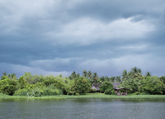 Fototapeta premium river house during monsoon in thailand