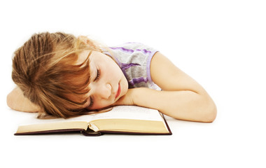 Sleeping little girl with book