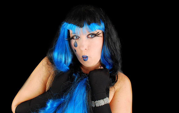 Halloween. Fashion portrait of funny cloun  on the black .