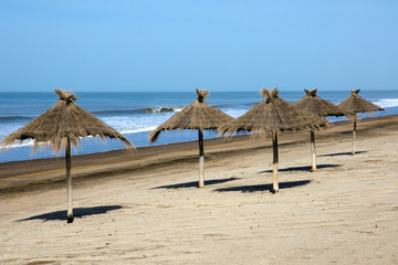 Sunshades at an empty beach
