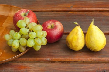 apples grapes and pears, wooden table