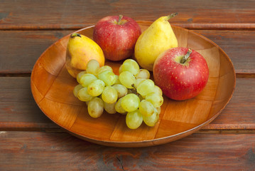 apples grapes and pears, wooden table