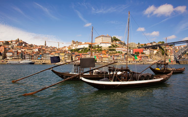 panorama old Porto river Duoro, vintage port transporting boats,