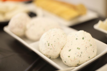 Gourmet seasoned mozzarella cheese balls.