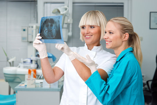 woman dentist with her assistant