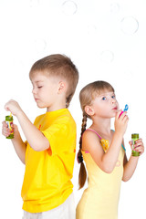 kids playing with bubbles isolated on white