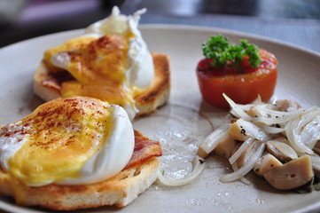 Eggs Benedict , poached egg on toasted bread