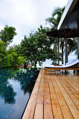 Luxury sunbeds and infinity-edge pool overlooking the sea
