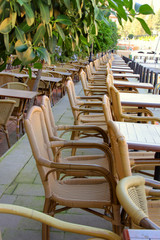 Street cafe with wicker chairs