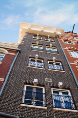 Image of brick building rising up to the sky