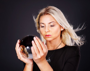 Young woman with crystal ball.