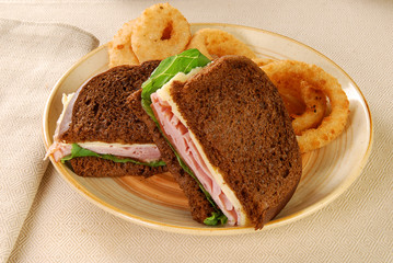 Ham and cheese sandwich with onion rings