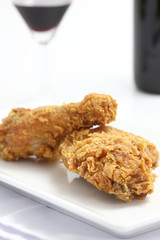 fried chicken and wine  isolated in white background