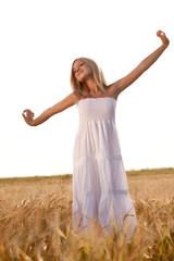 woman walking on wheat field