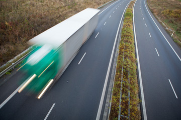 highway traffic - motion blurred truck on a highway/motorway/spe