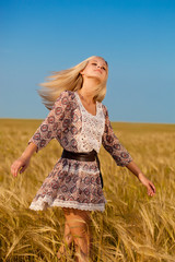 woman walking on wheat field