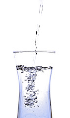 pouring water into a glass