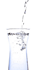 pouring water into a glass