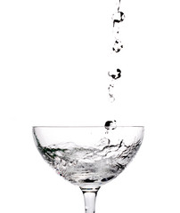 pouring water into a glass