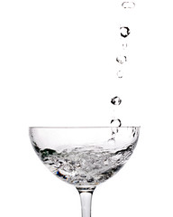 pouring water into a glass