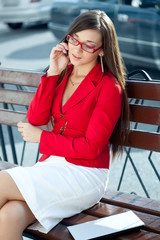 businesswoman  calling by phone outdoors