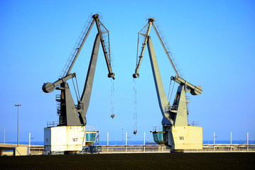 Fototapeta na wymiar cargo cranes in port of barcelona