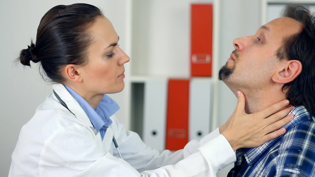 Female doctor examine patient for sore throat