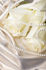 Pearl beads and cream rose