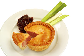 Pork pie with spring onions and brown pickle