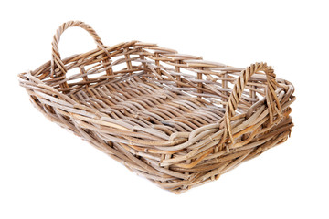 Obraz premium Big empty cane basket over white background